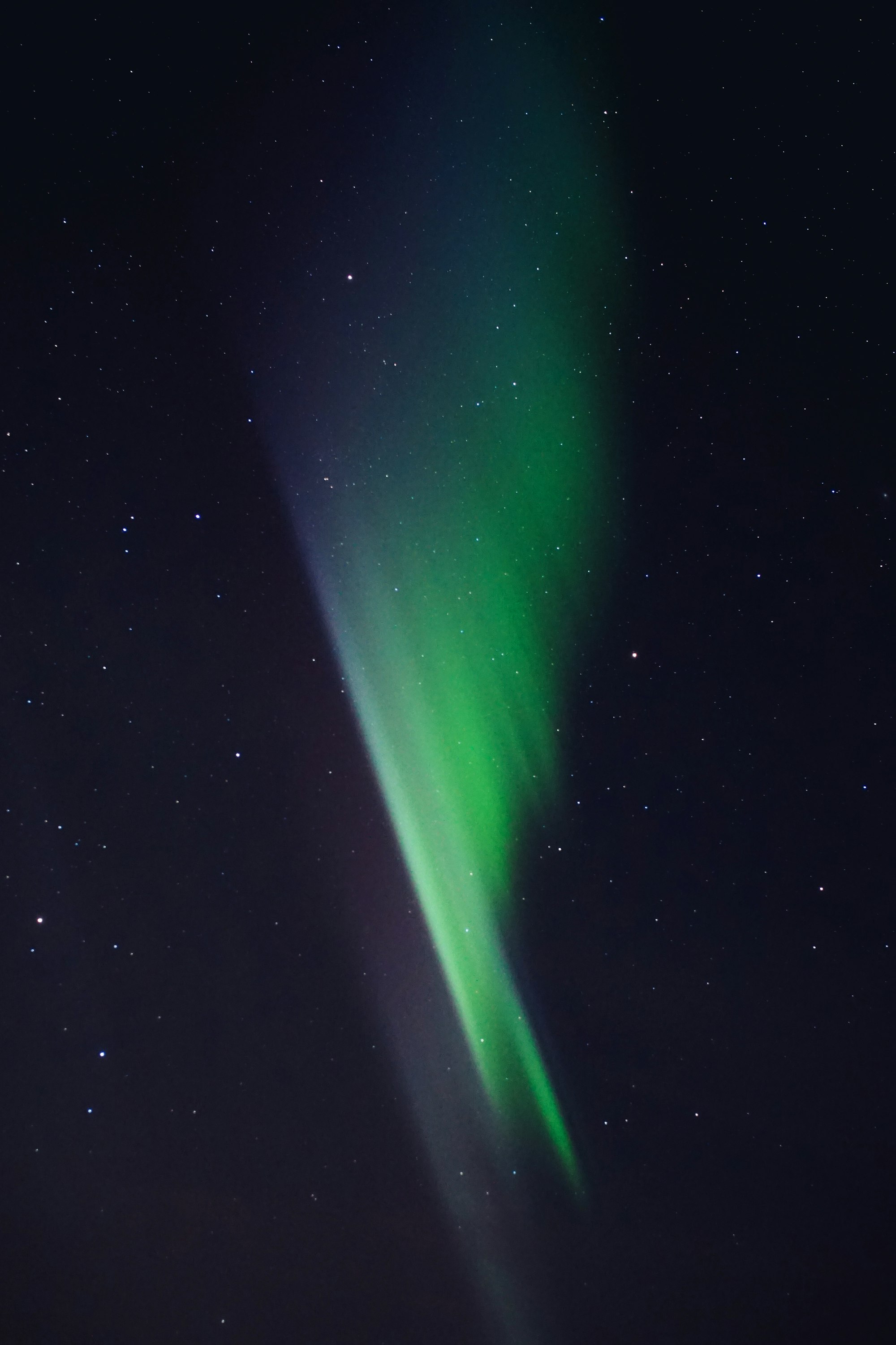 Green aurora in a night sky